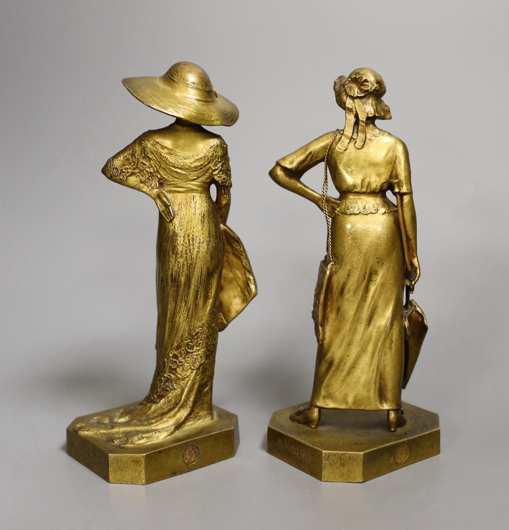 Henri Varenne (1860-1933). A pair of bronze figures 'La Parisienne 1911 and 1912', 18cm tall